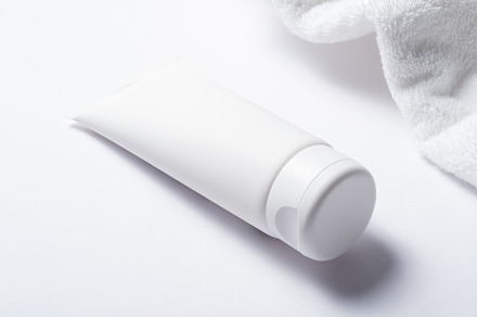 White plastic tube for cosmetic with terry towel, minimalistic c