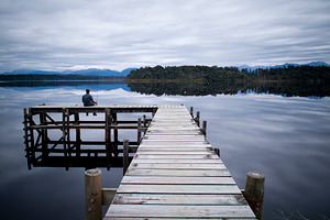 Lone Fisherman On Pier, a Nature Photo by THP Creative