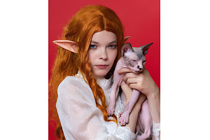 Portrait of cosplayer elf and cat, a Person Photo by Alexander-Piragis