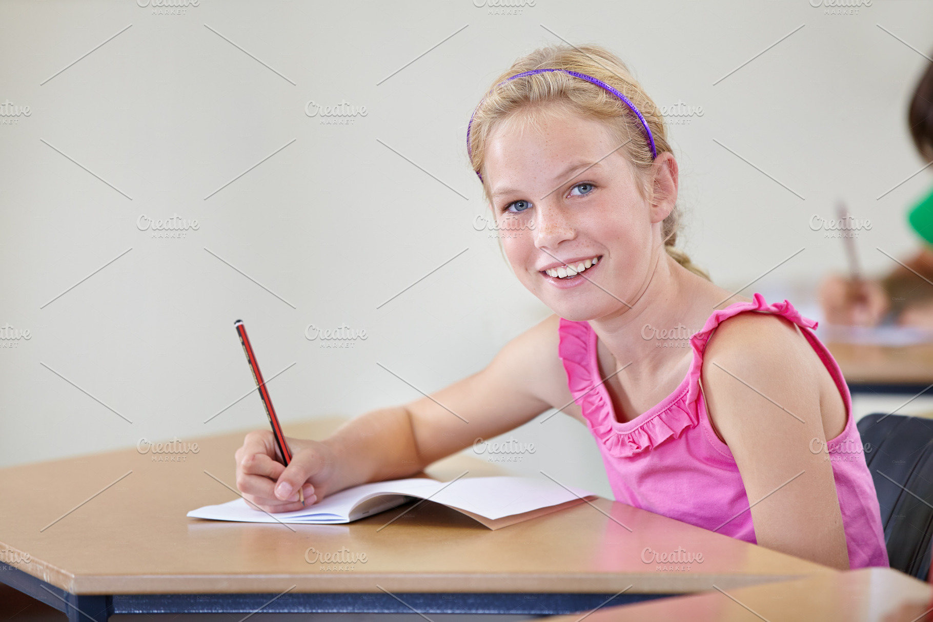 Working hard at school, a Photo by Peopleimages.com