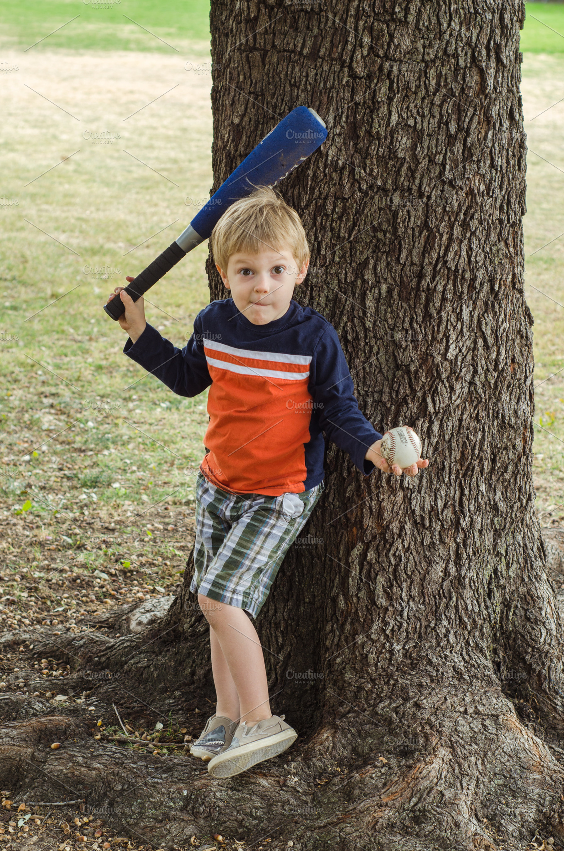 Boy with Bat and Ball Making a Face