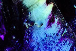 Abstract image of wet glass surface with vivid cyan, purple, and, an Abstract Photo by Ales Munt