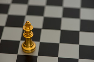 The figure of the king on the chess containing battle, black, and board