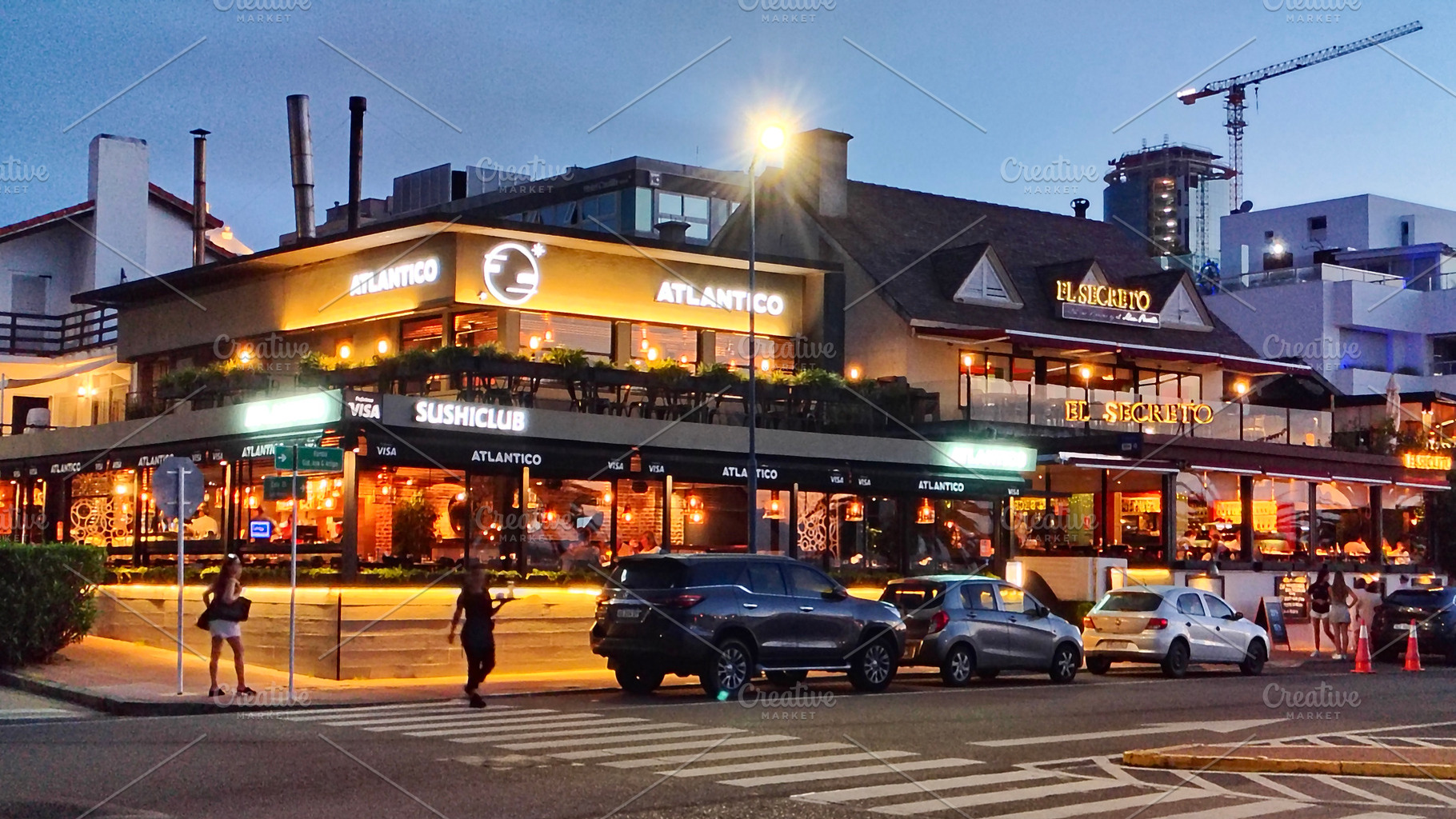 Restaurant zone near port night urban scene, punta del este urug, a Person Photo by DanFLCreativo