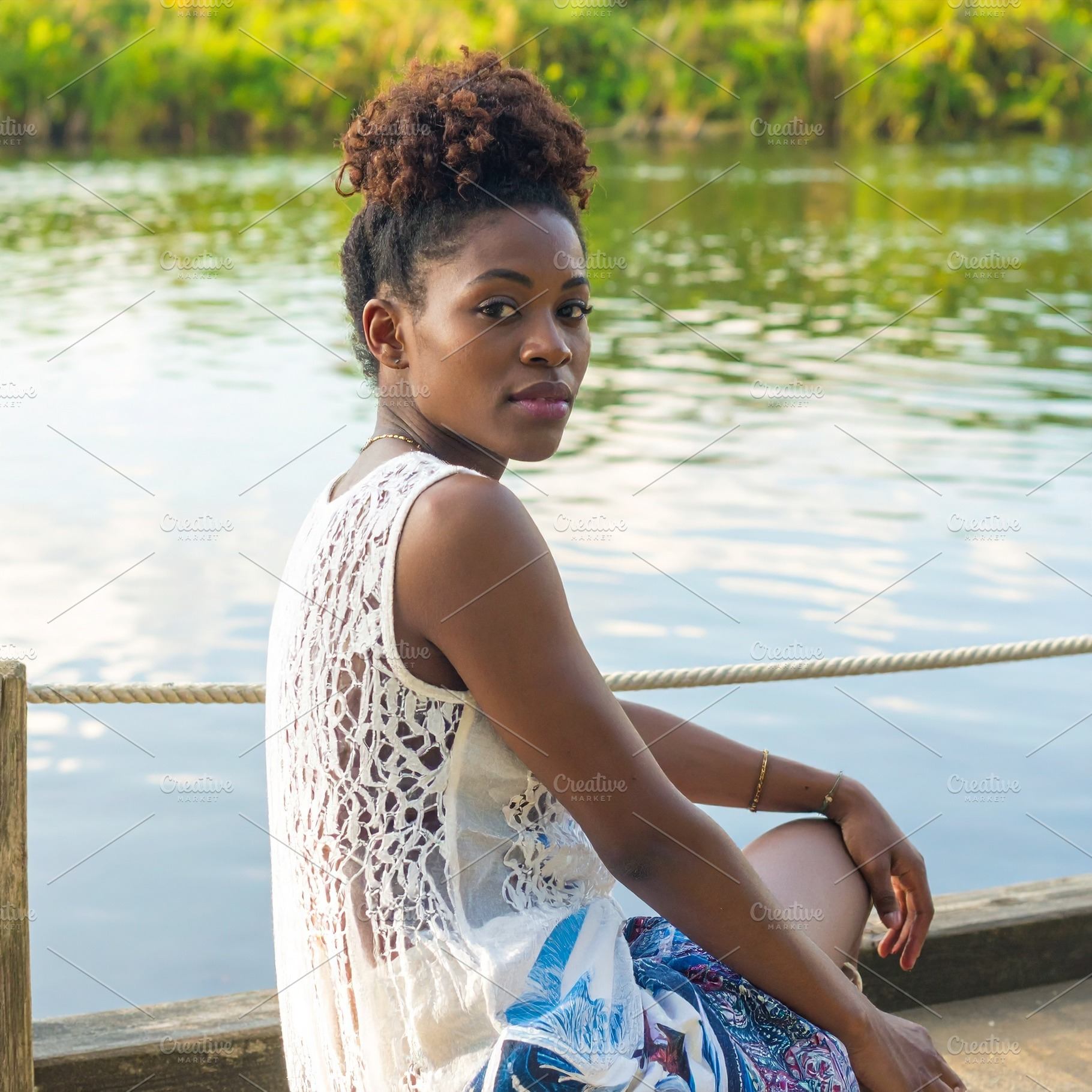 beautiful young woman by the river AI generated, a Photo by WorldOfPhotos