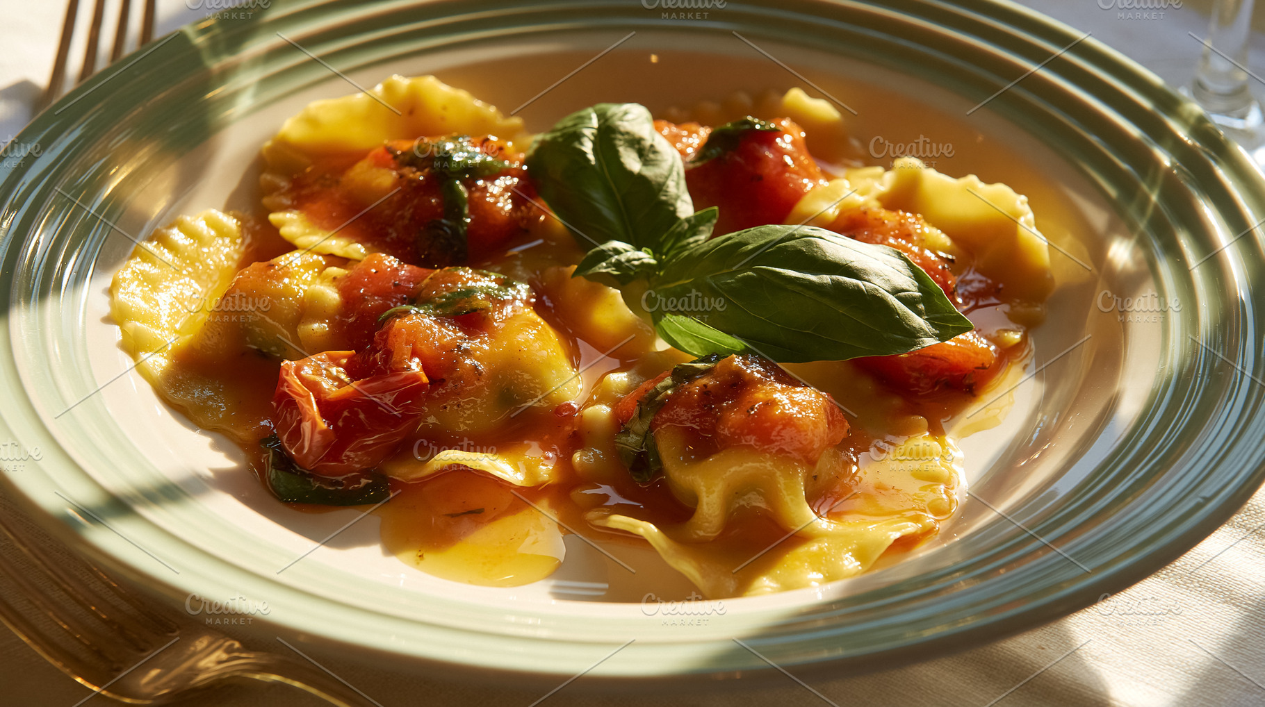 Fresh ravioli pasta with tomato and basil sauce, traditional Italian cuisine di, a Photo by Studio ANNA