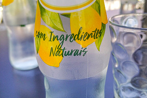 Pedras limao bottle on a restaurant table, a Food & Drink Photo by DanFLCreativo