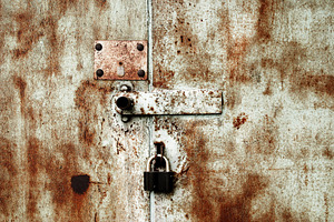 Old rusty lock on the door, a Photo by saiko3p