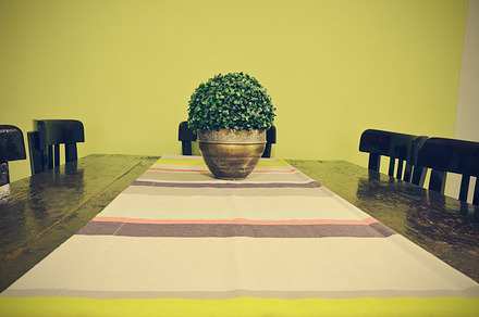 Dining table with vase and table runner