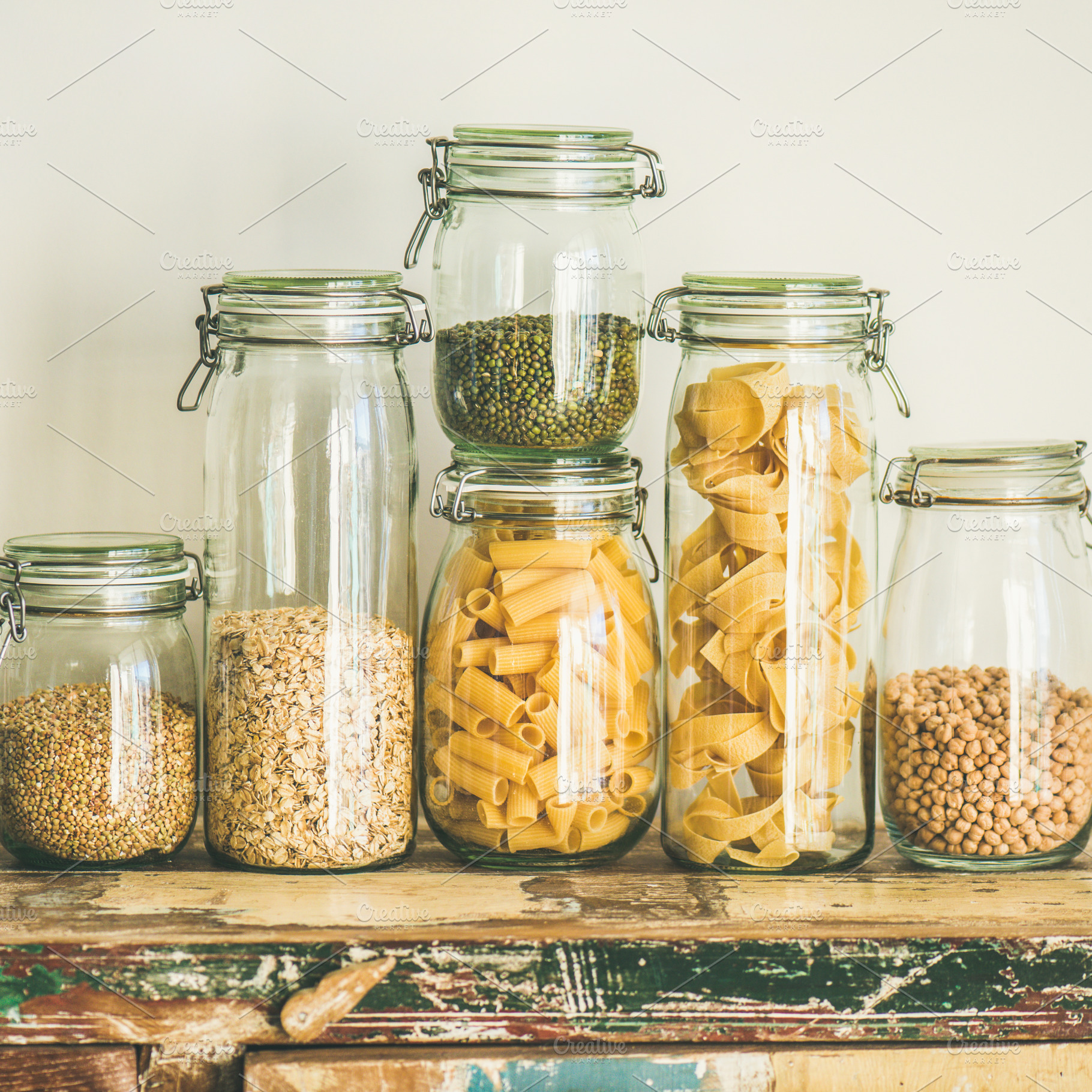 Uncooked cereals, grains, beans and pasta on table, square crop, a Food & Drink Photo by Foxys