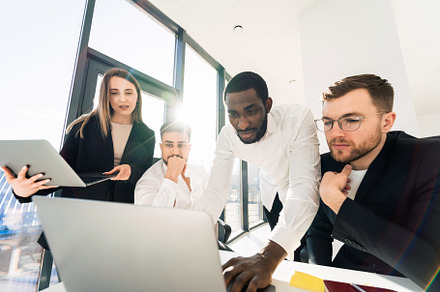Team of interracial people working, a Photo by borodai94