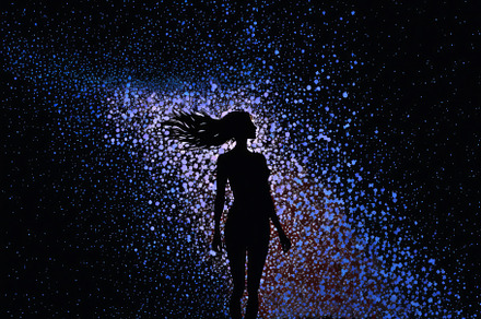Painting of a women's silhouette in front of a colorful glitter