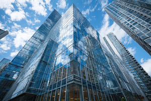 Modern glass skyscrapers reflecting, a Photo by Pixeness Studio