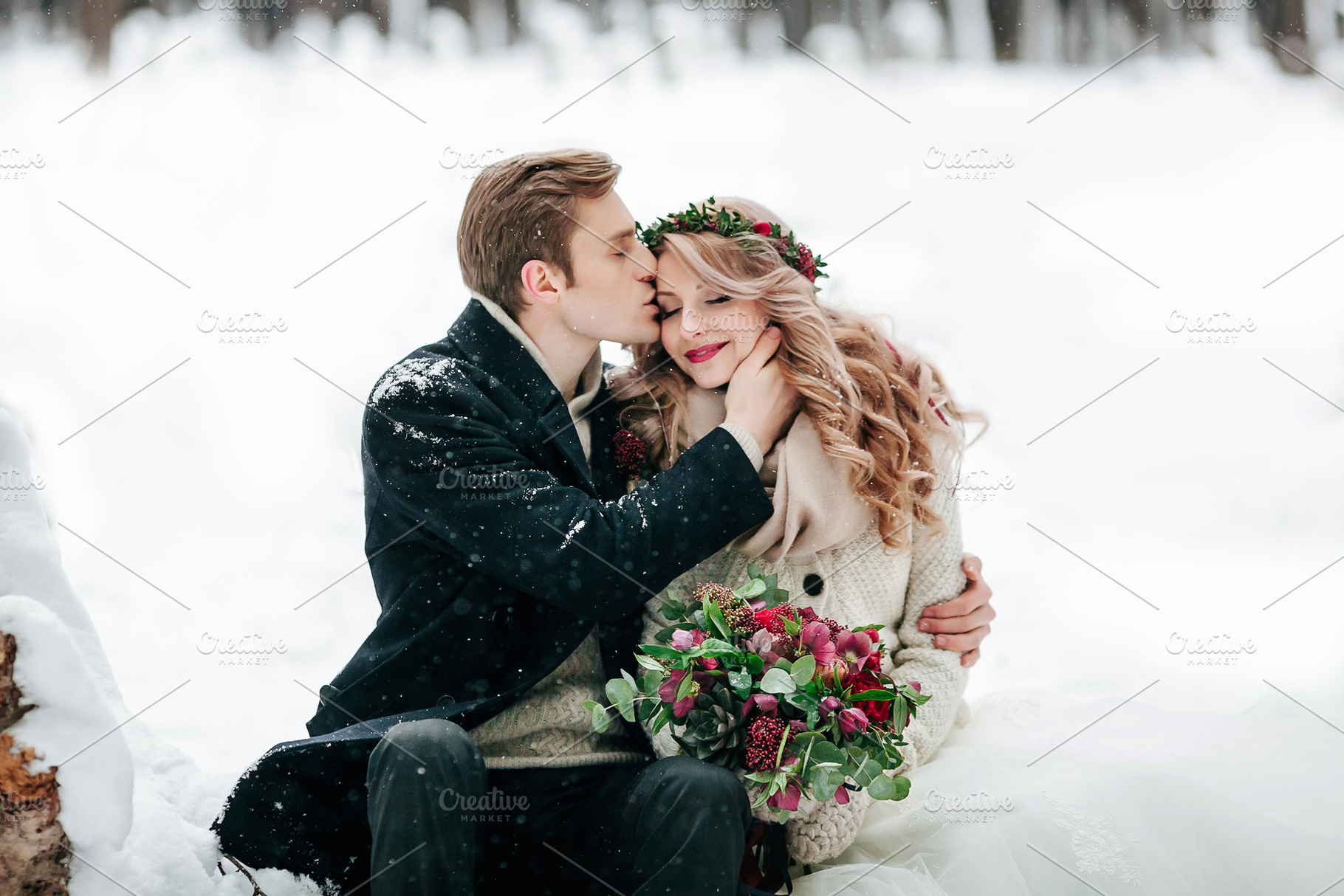 Groom is kissing his bride on the temple on the white snow background. Artwork. Selective focus on the bouquet, a Food & Drink Photo by Stahov