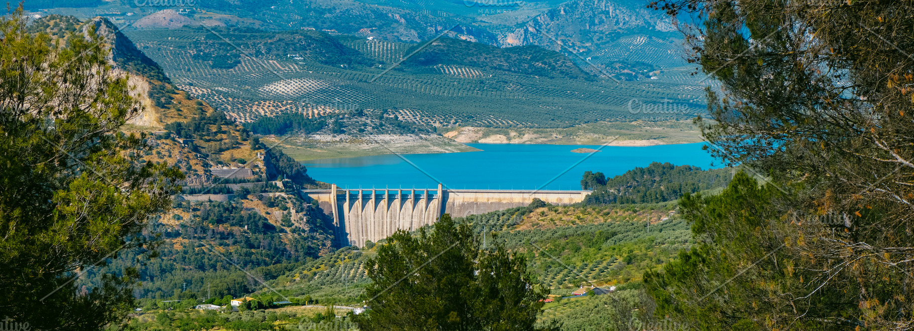 panoramic view of the Iznajar reservoir dam, Spain, a Photo by Nito