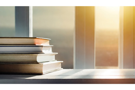 A stack of books by a sunlit window, a School & Education Photo by Igor Tichonow