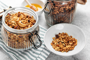 Homemade granola cereal with nuts fruits and honey, a Food & Drink Photo by Olena Rudo