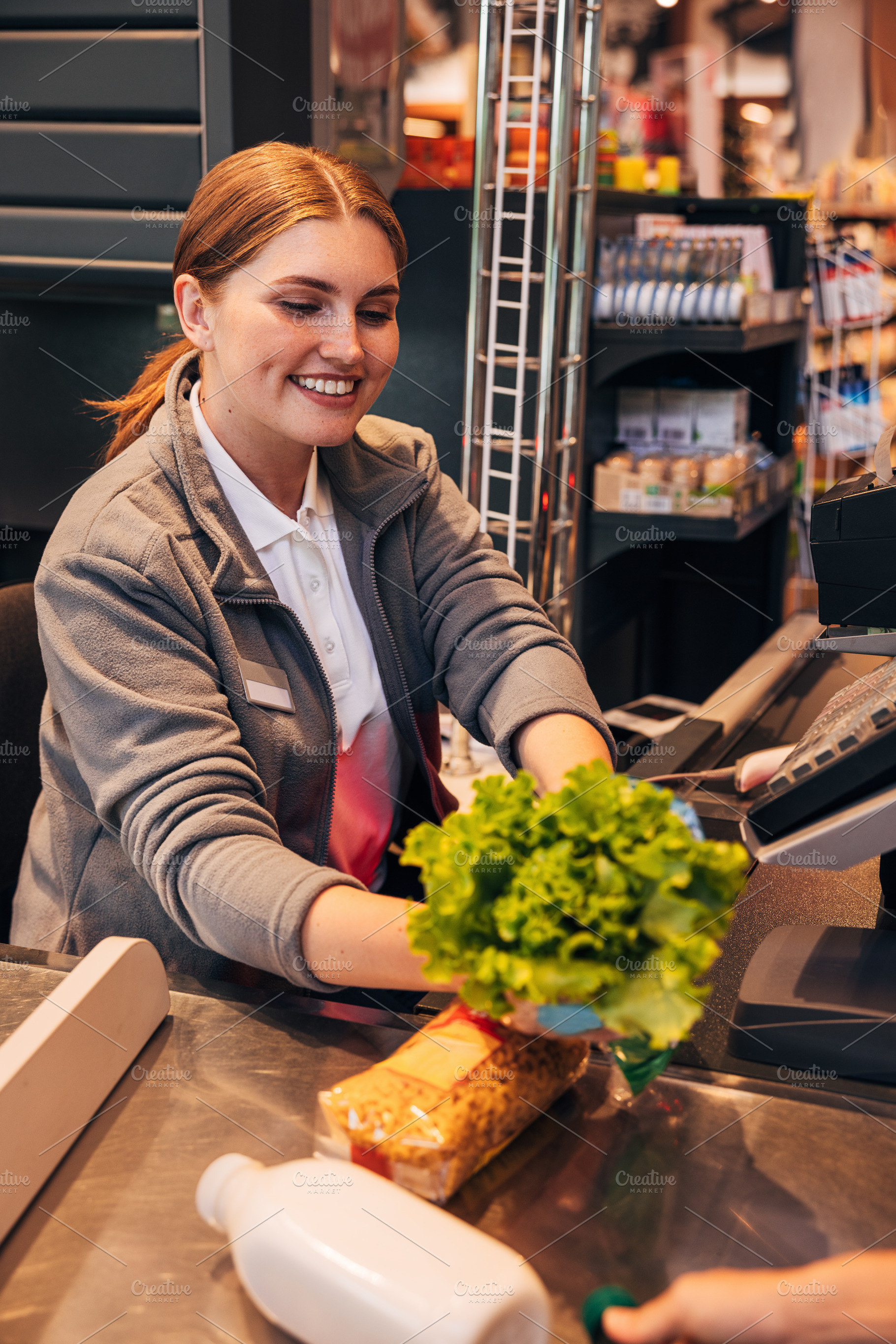 Cheerful woman cashier, a Person Photo by Artem Varnitsin
