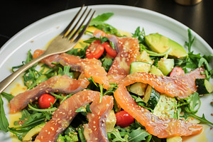 Salad with salted salmon and arugula, a Food & Drink Photo by Budarinphoto