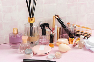 Cosmetic products and personal care accessories on pink surface, a Beauty & Fashion Photo by Olena Rudo