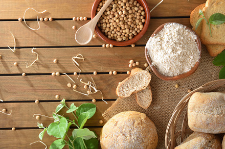Bread made with soy flour on rustic table top view, a Food & Drink Photo by Davizro's Market