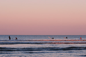 Surfers at Dusk New Zealand Photo