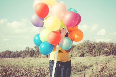 Colorful balloons containing woman, balloons, and happy, a Holiday Photo by jakkapan