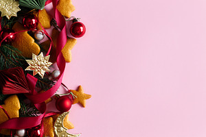 Festive Christmas background with gingerbread cookies, red ribbo, a Photo by Sonjachni