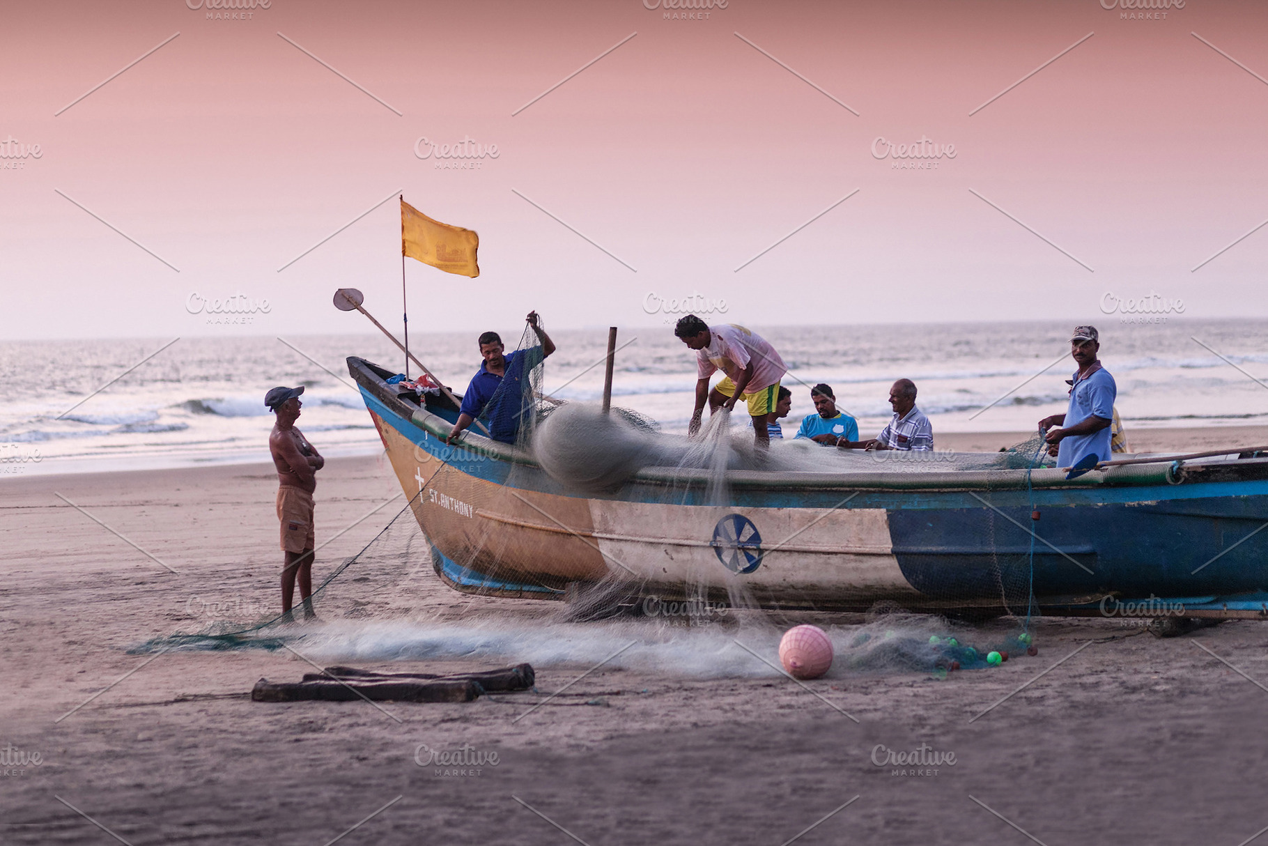 Fishermans picking up their nets, a Photo by saiko3p