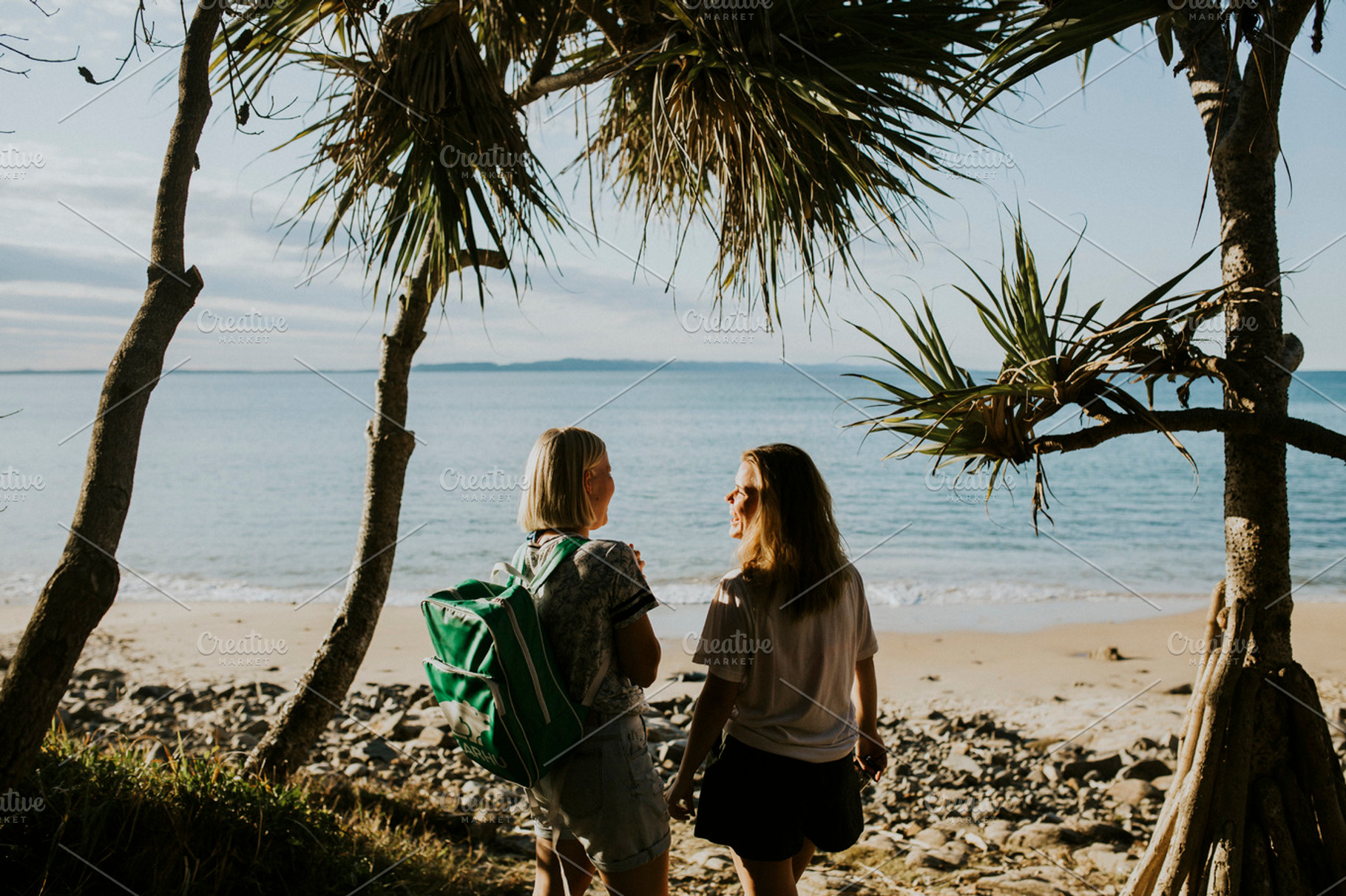 Girls exploring beach, a Person Photo by Heart Visuals