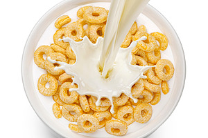 Corn rings with milk isolated, a Food & Drink Photo by Max Lashcheuski