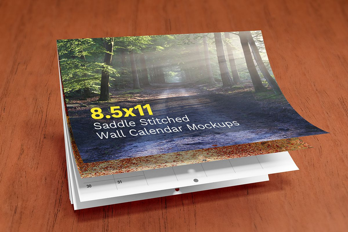 Saddle Stitched Wall Calendar Mockup, a Mockup by Vectogravic Design (Photo 3 of 7)