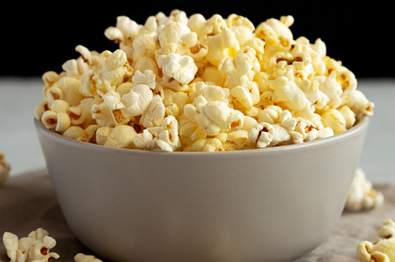 Homemade Salty Popcorn in a Bowl, side view., a Food & Drink Photo by LiudmylaChuhunova