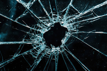 Shattered glass surface, featuring sharp, jagged edges radiating from a central, a Background Photo by Textures & Backgrounds