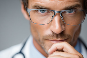 Serious, focus male doctor, a Health & Medical Photo by MistyDay