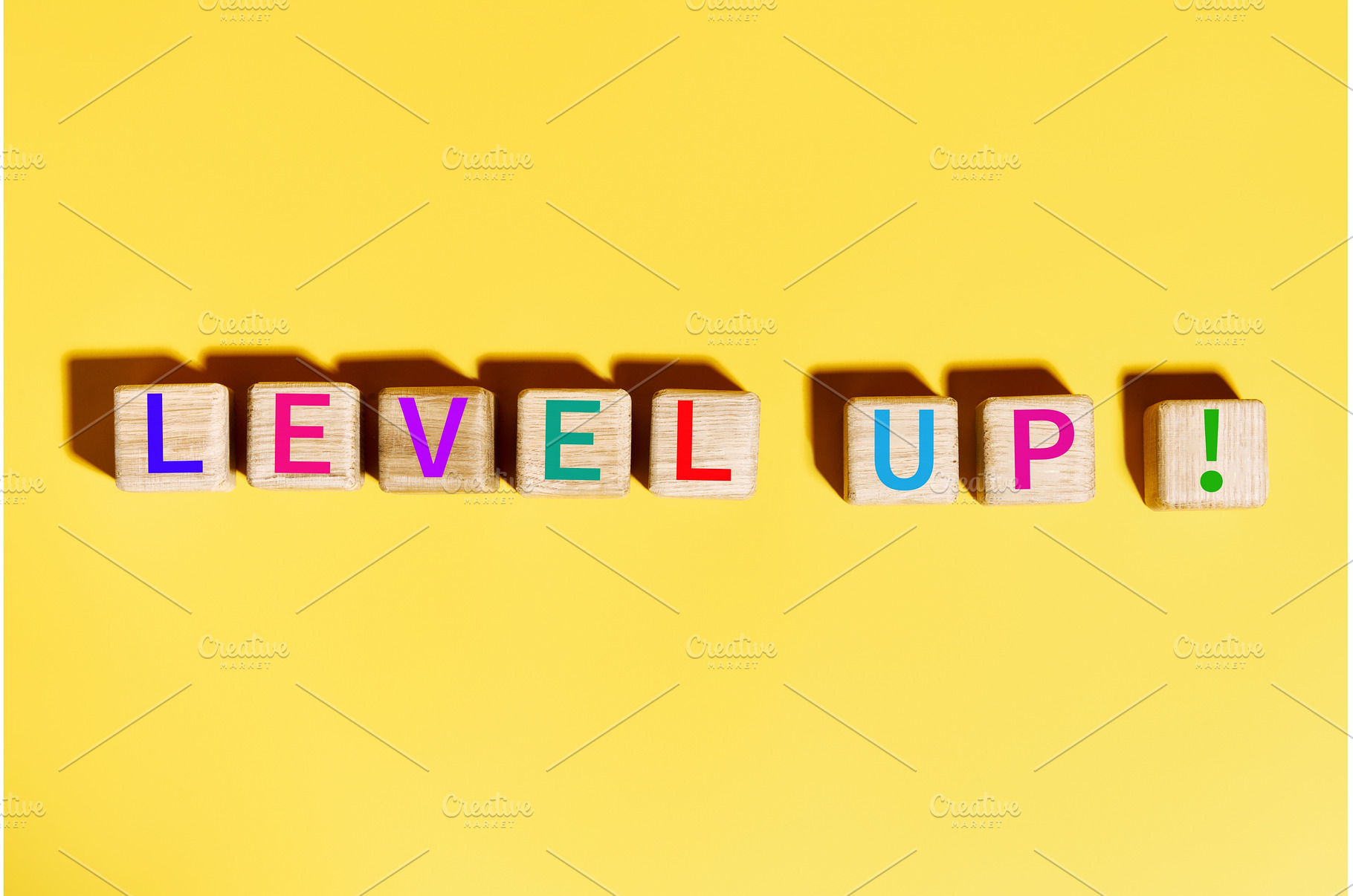 Colorful Level Up text on wooden, a Business Photo by Gladkov photography