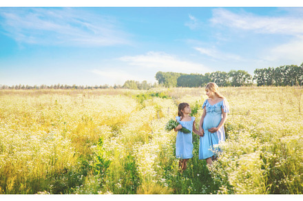 pregnant woman with daughter in a, a Person Photo by yanadjana