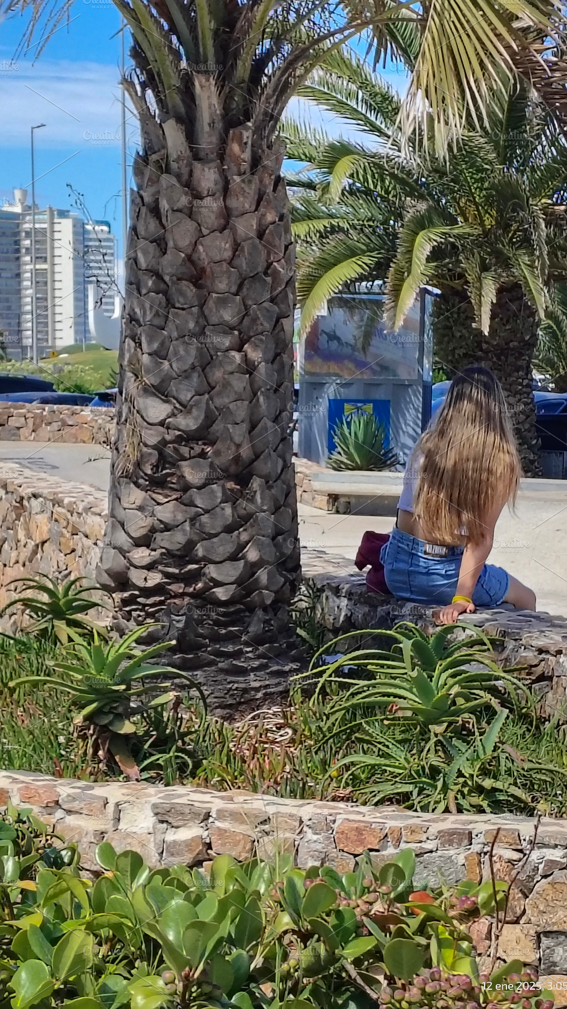 Teen wonan sitting at public park, punta del este city, maldonad, an Architecture Photo by DanFLCreativo