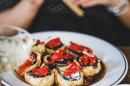 Girl eating baked sushi with, a Food & Drink Photo by Foxys