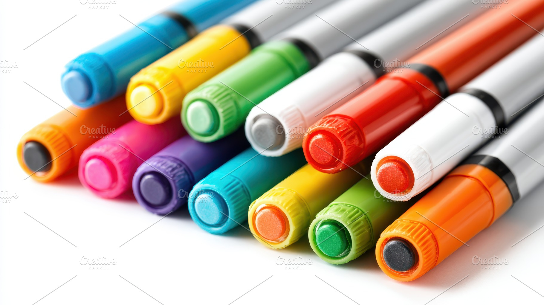 Colorful markers arranged in a row, an Abstract Photo by AlyaAnd