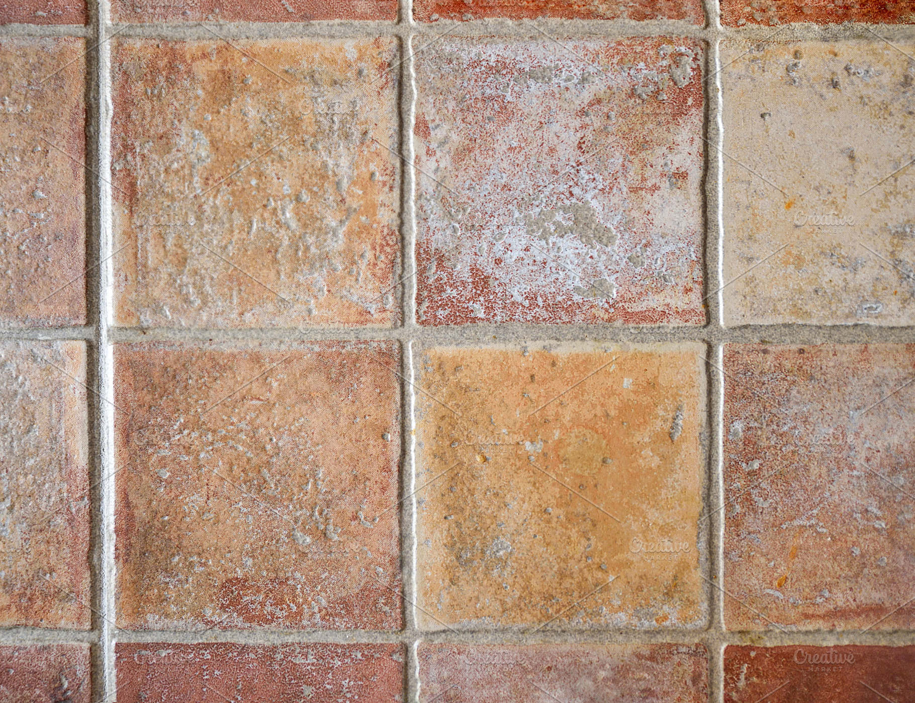 Rrustic tiles in brown tones placed on the wall, an Abstract Photo by Davizro's Market