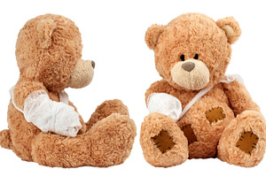 Soft brown teddy bears sitting with bandaged arms and visible st, a Health & Medical Photo by ndanko