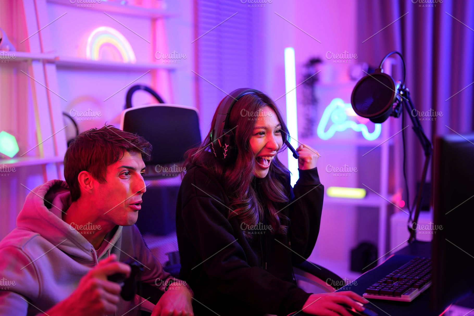 Gamer Couple Playing Game, a Sports & Recreation Photo by MergeIdea