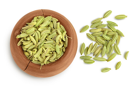 Dried fennel seeds in wooden bowl, a Food & Drink Photo by NataPhoto