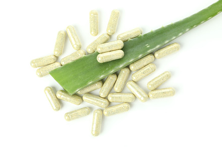 Aloe leaf and pills isolated on white background, a Beauty & Fashion Photo by AtlasStudio PRO