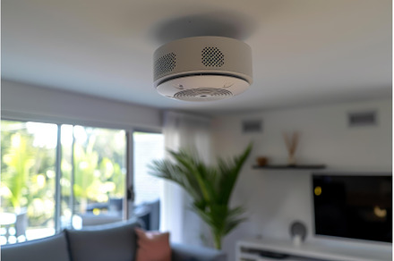 Modern smoke detector hanging on, a Technology Photo by Ylivdesign