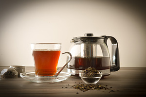 Cup of tea and lemon with white isolated background, a Food & Drink Photo by Davizro's Market