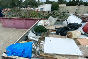a container with mixed bulky waste at a recycling facility, a Photo by Nito