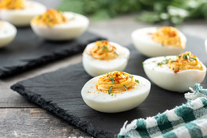 Homemade hard Boiled Deviled Eggs garnished with herbs, a Food & Drink Photo by etorres69