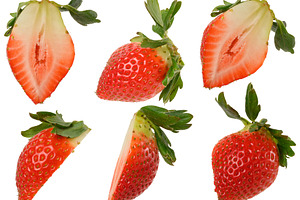 Set of halves of fresh ripe strawberries with green sepals, isol, a Food & Drink Photo by ndanko